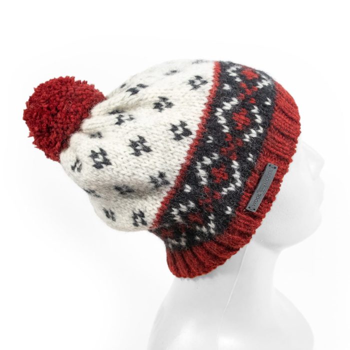 Knitted wool hat with pattern and pom pom, white